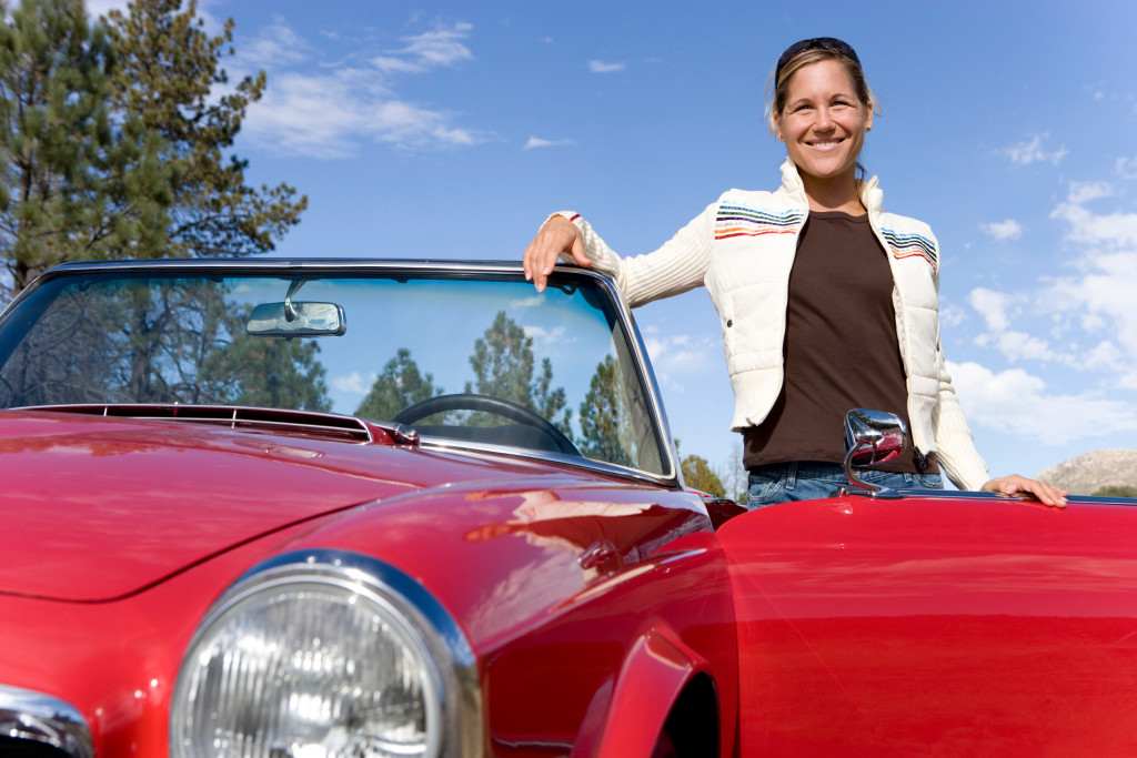 woman with her sports car